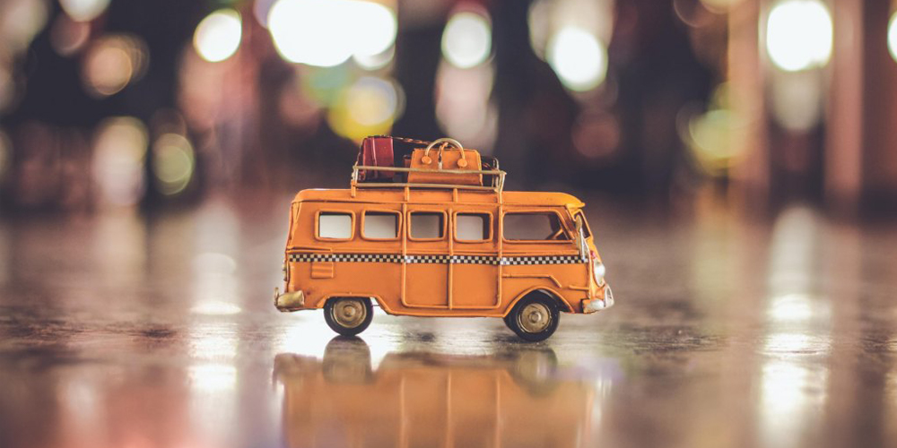 A yellow toy campervan